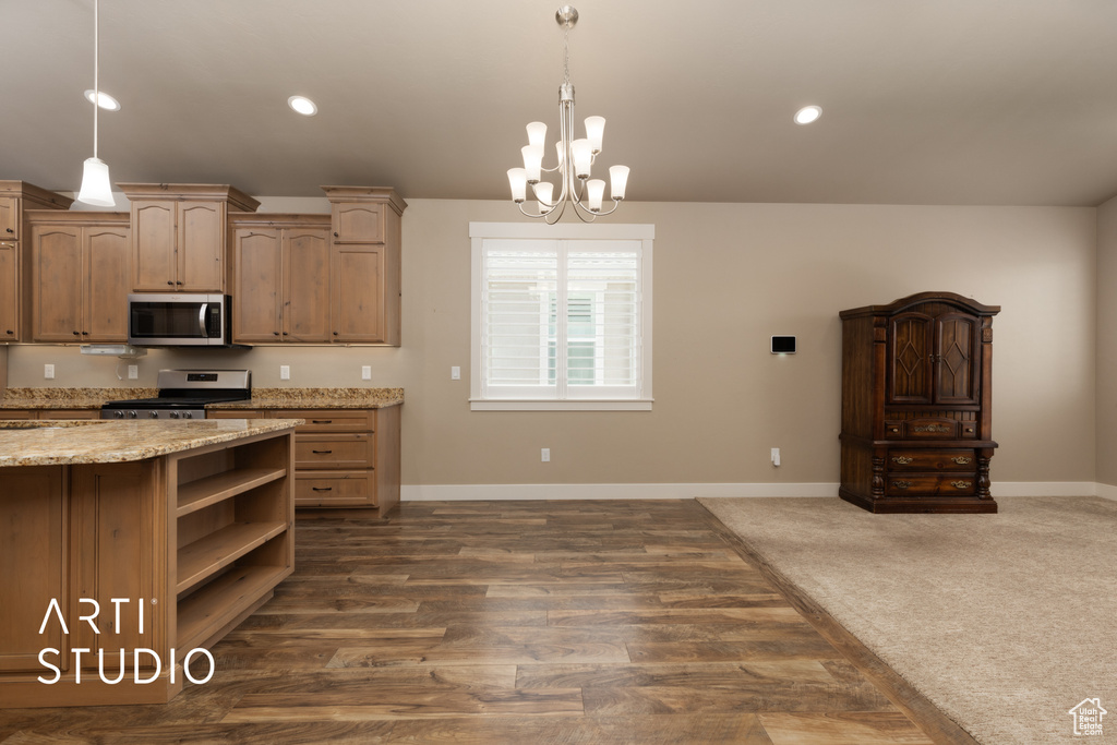 Kitchen featuring stainless steel appliances, a chandelier, open shelves, decorative light fixtures, and recessed lighting
