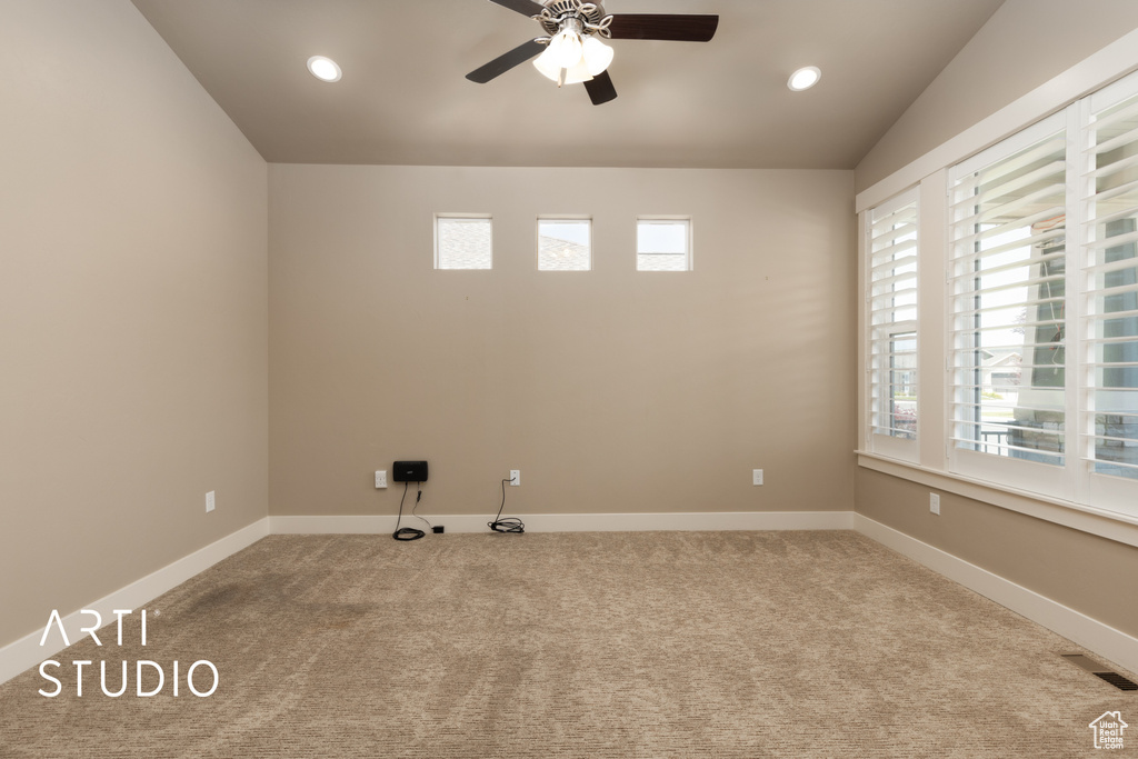 Spare room featuring a ceiling fan, carpet flooring, vaulted ceiling, and recessed lighting