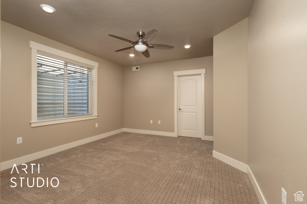 Unfurnished room with ceiling fan, carpet flooring, and recessed lighting