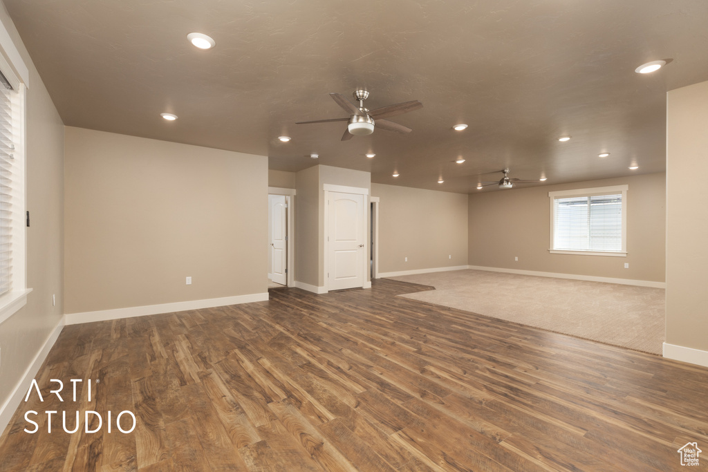 Spare room with ceiling fan, wood finished floors, and recessed lighting