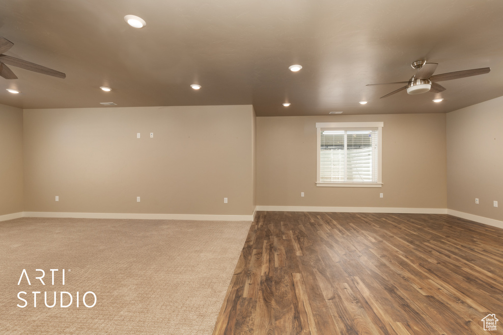 Spare room with a ceiling fan, recessed lighting, and wood finished floors