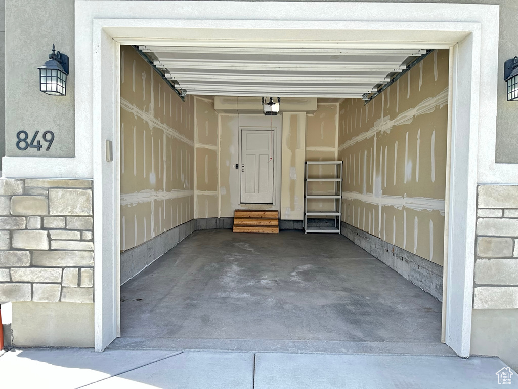 Garage featuring a garage door opener