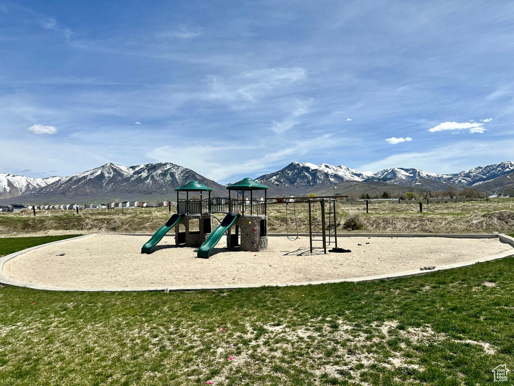 Community jungle gym featuring a mountain view