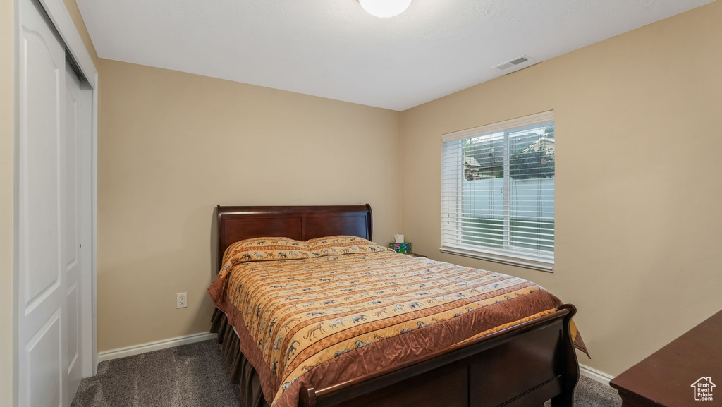 Bedroom with carpet floors and a closet