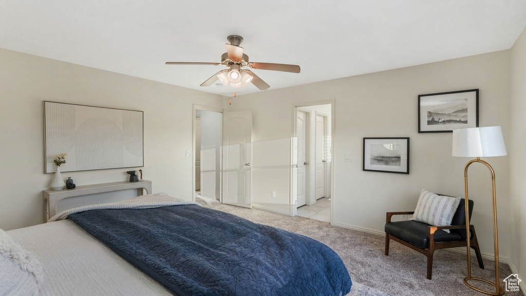 Bedroom featuring light carpet and a ceiling fan