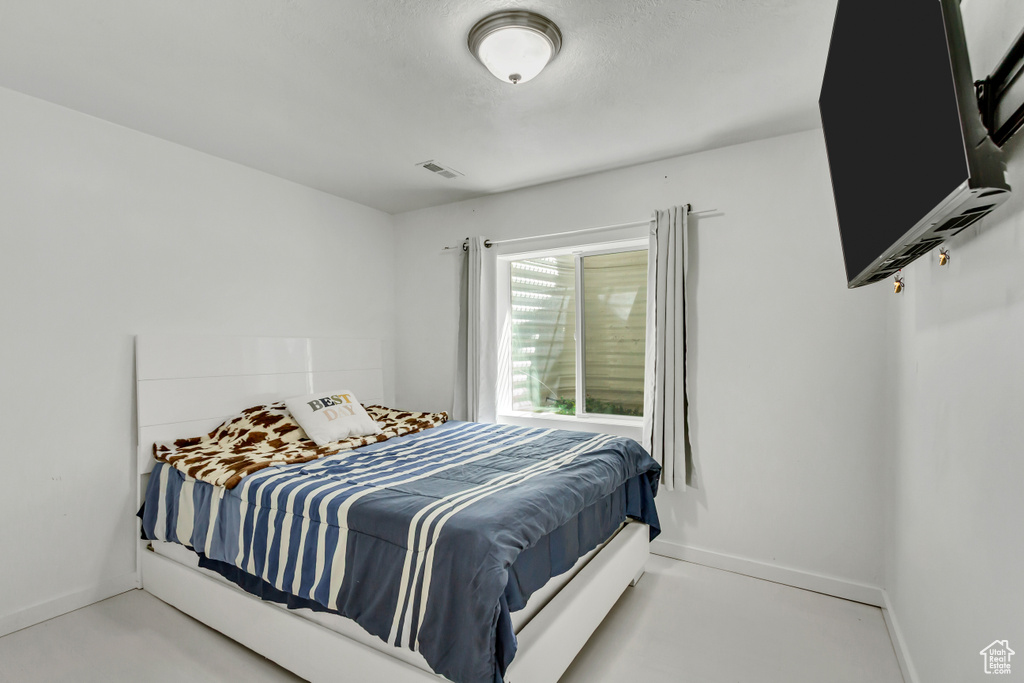 Bedroom featuring baseboards