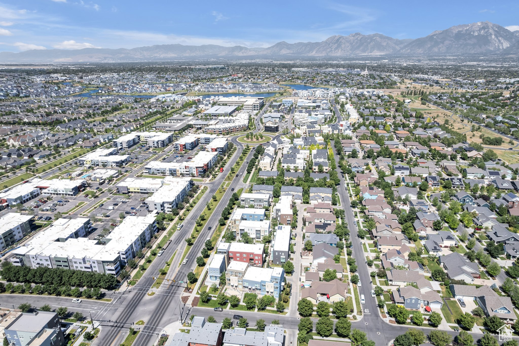 Aerial view of property's location featuring a mountainous background