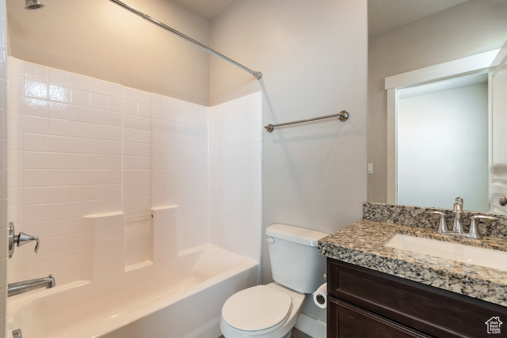 Bathroom with shower / bathtub combination and vanity