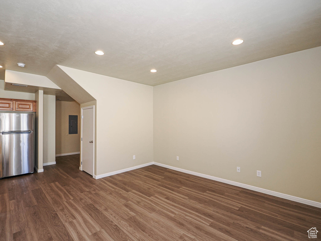 Spare room featuring electric panel, recessed lighting, dark wood-style floors, and a smoke detector