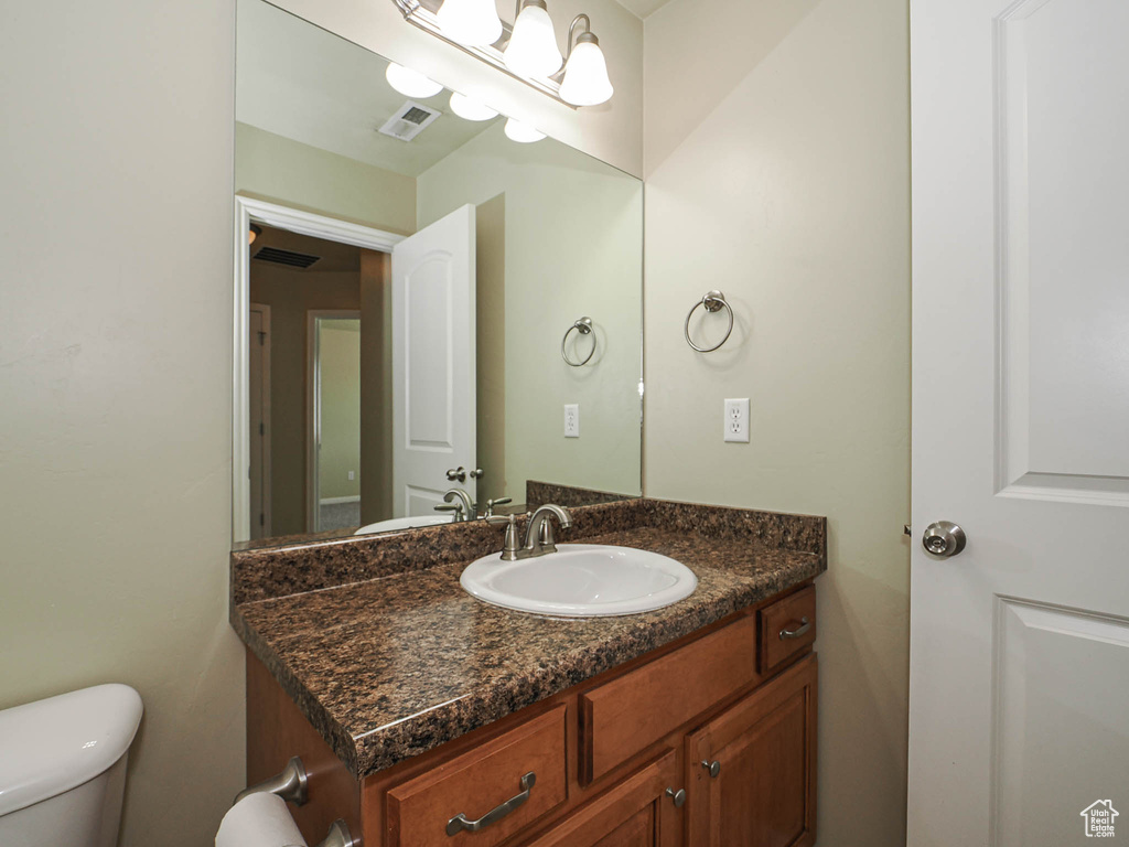 Bathroom with vanity and toilet