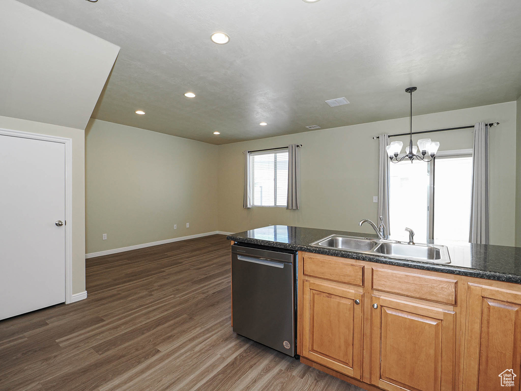 Kitchen featuring dishwasher, wood finished floors, recessed lighting, a chandelier, and open floor plan