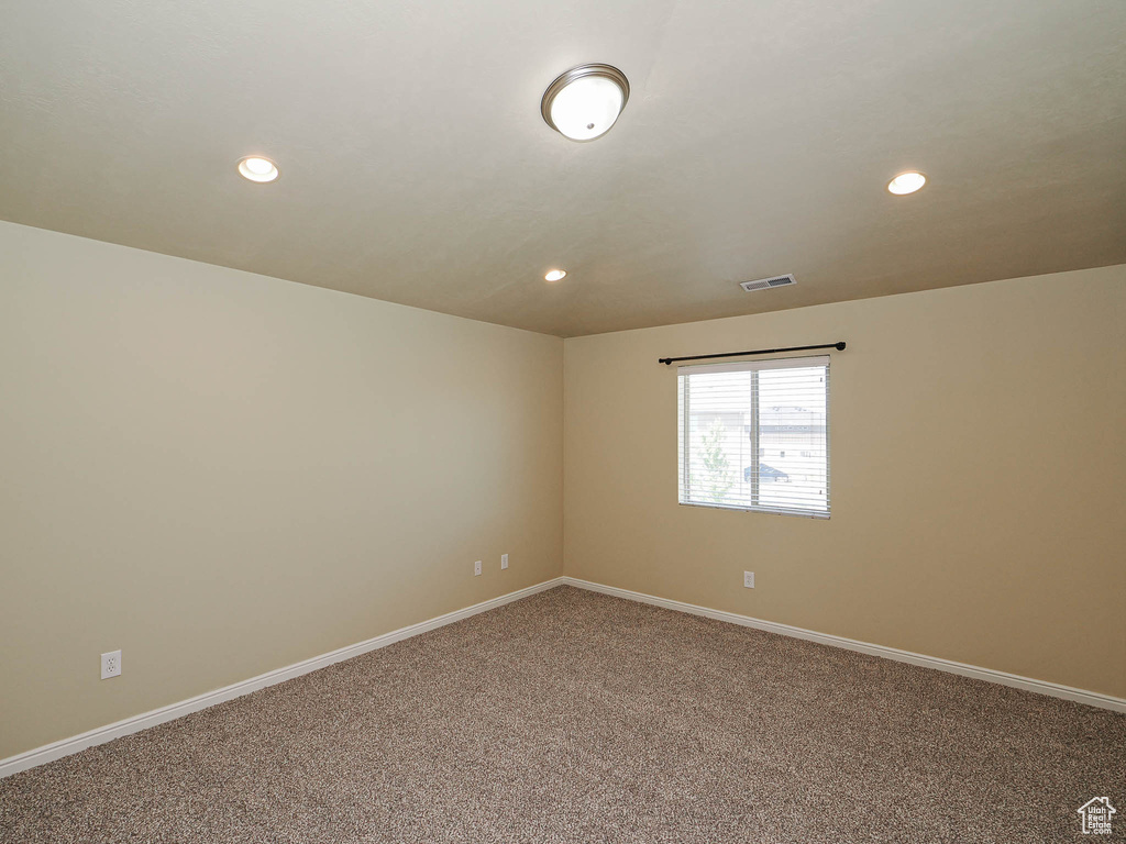 Spare room with carpet floors and recessed lighting