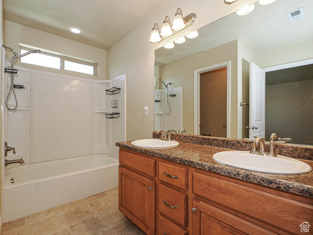 Bathroom with washtub / shower combination and double vanity
