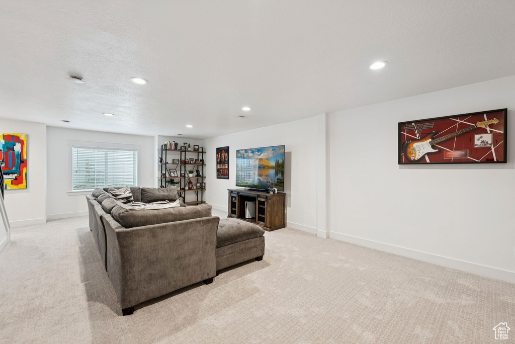 Living room featuring light carpet and recessed lighting