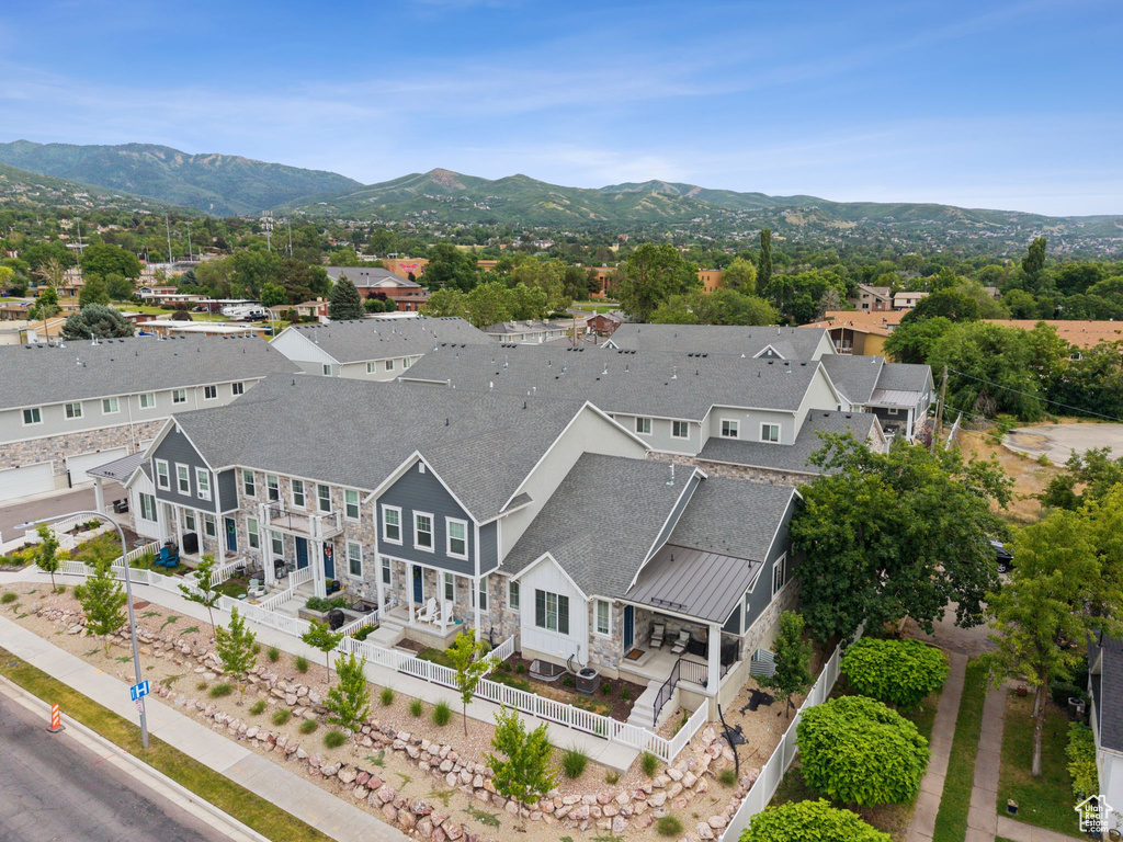 Aerial perspective of suburban area with a mountainous background