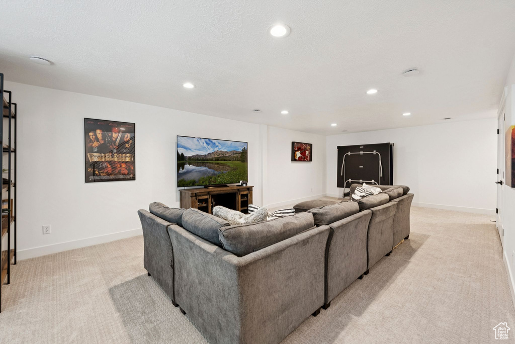 Living room featuring light carpet and recessed lighting