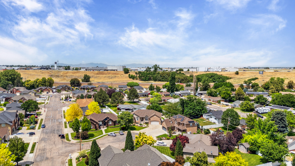 Aerial perspective of suburban area with a mountainous background