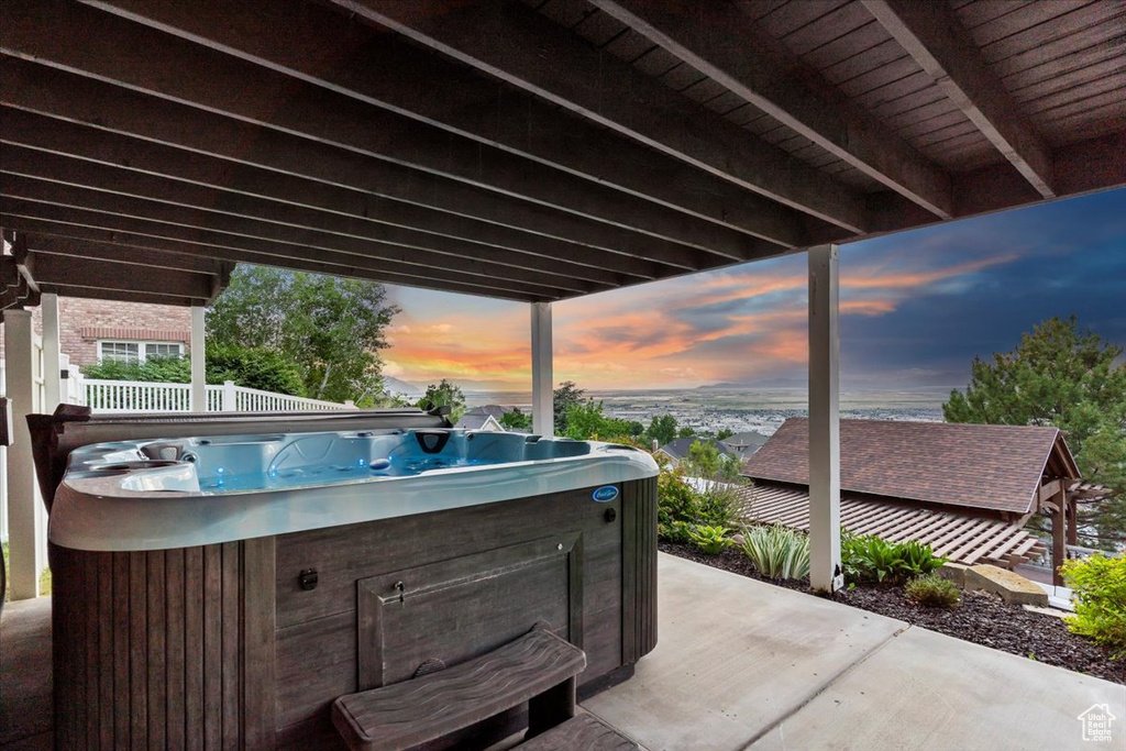 View of patio featuring a hot tub