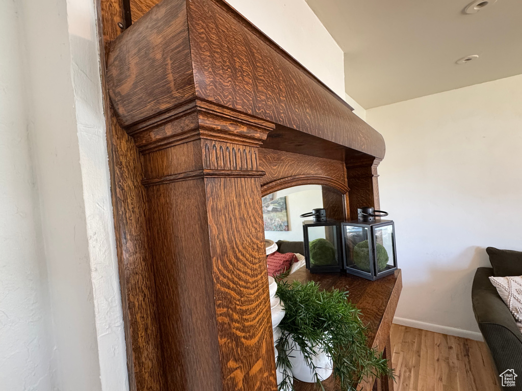 Detailed view of wood finished floors and arched walkways