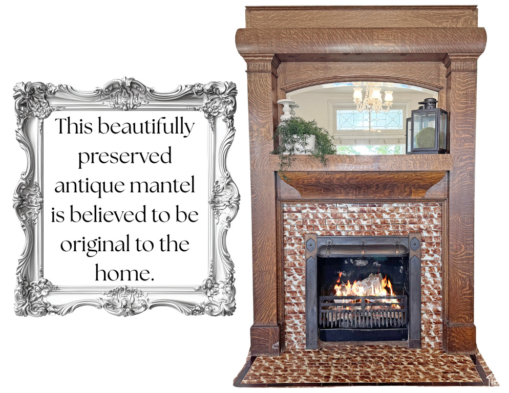 Detailed view of a chandelier and a tiled fireplace