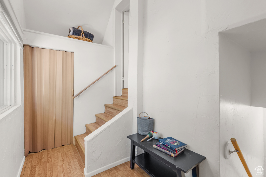 Staircase with wood finished floors