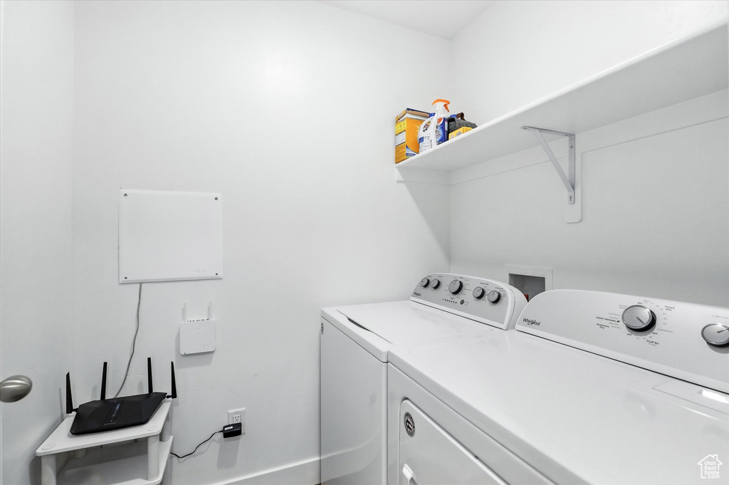Laundry room featuring washer and clothes dryer
