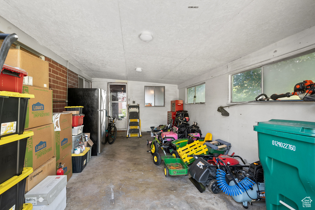 Garage with freestanding refrigerator