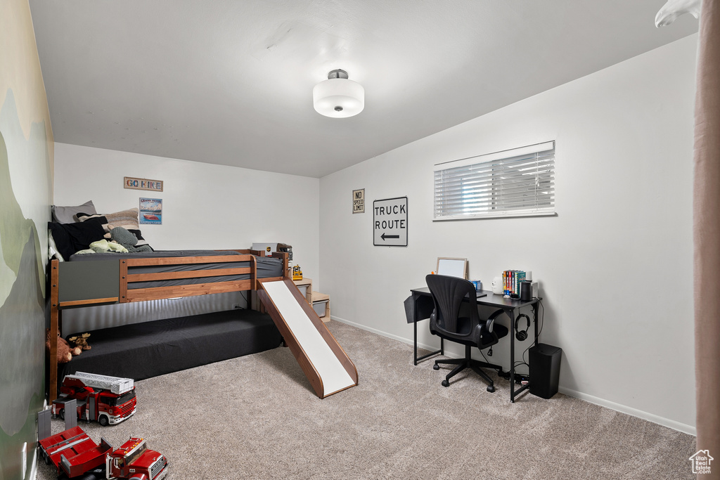 Carpeted bedroom with baseboards