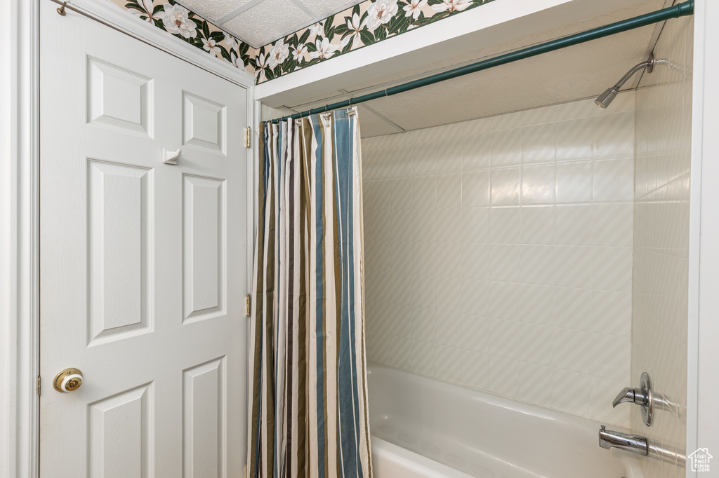 Full bathroom featuring shower / bath combo with shower curtain