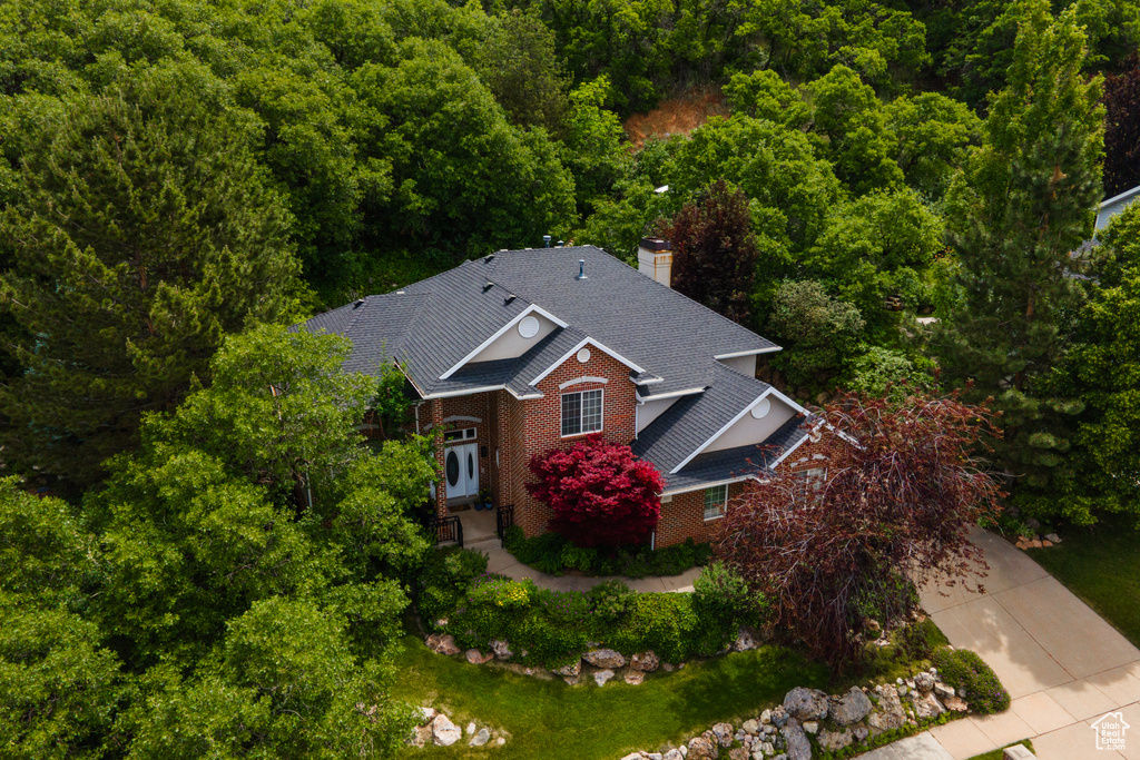 View from above of property with a heavily wooded area