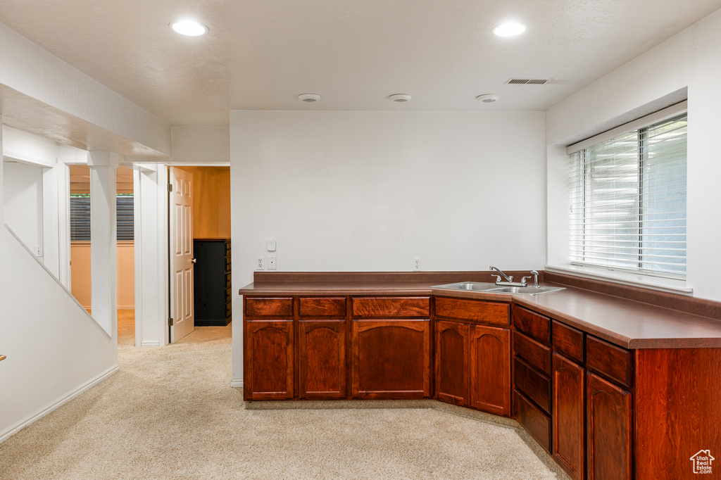 Kitchen featuring light carpet and recessed lighting