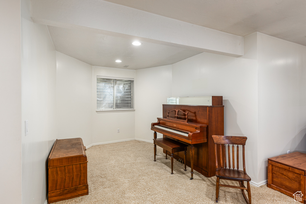 Living area featuring carpet flooring and recessed lighting