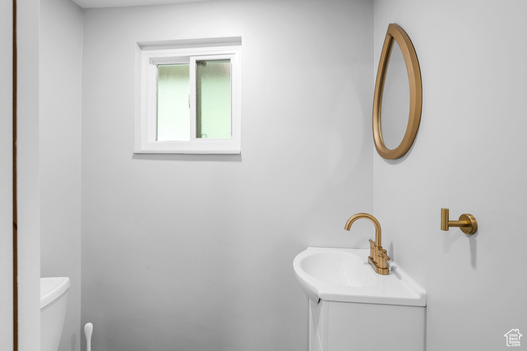 Bathroom featuring toilet and vanity
