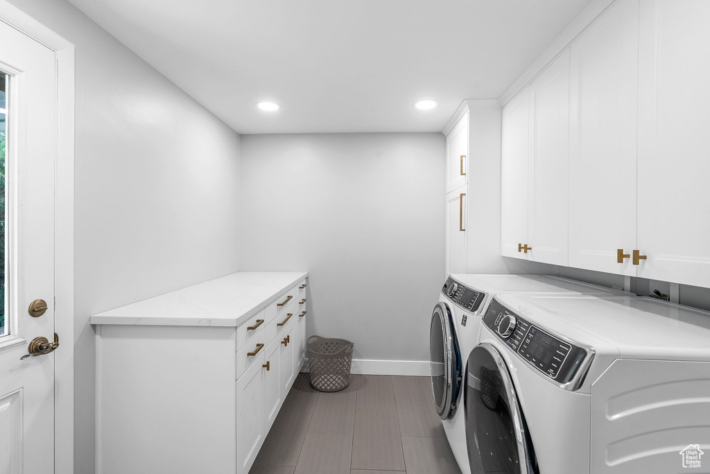 Laundry room with cabinet space, washing machine and dryer, and recessed lighting