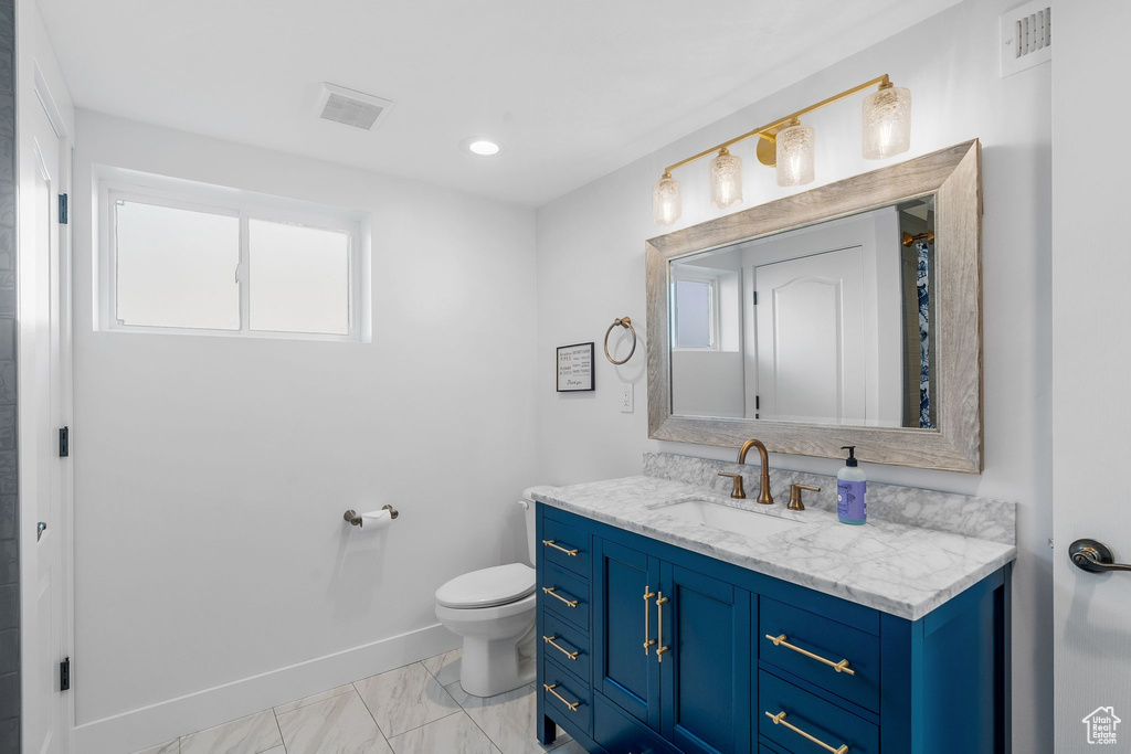 Bathroom with vanity and toilet