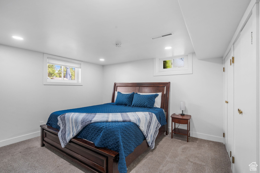 Bedroom with carpet floors and recessed lighting