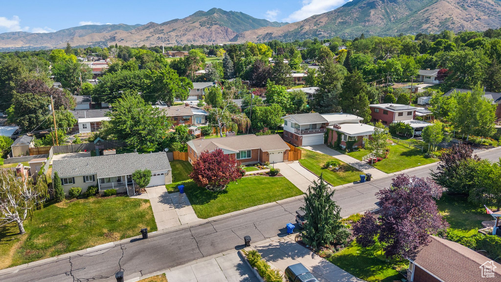 Aerial perspective of suburban area featuring a mountainous background