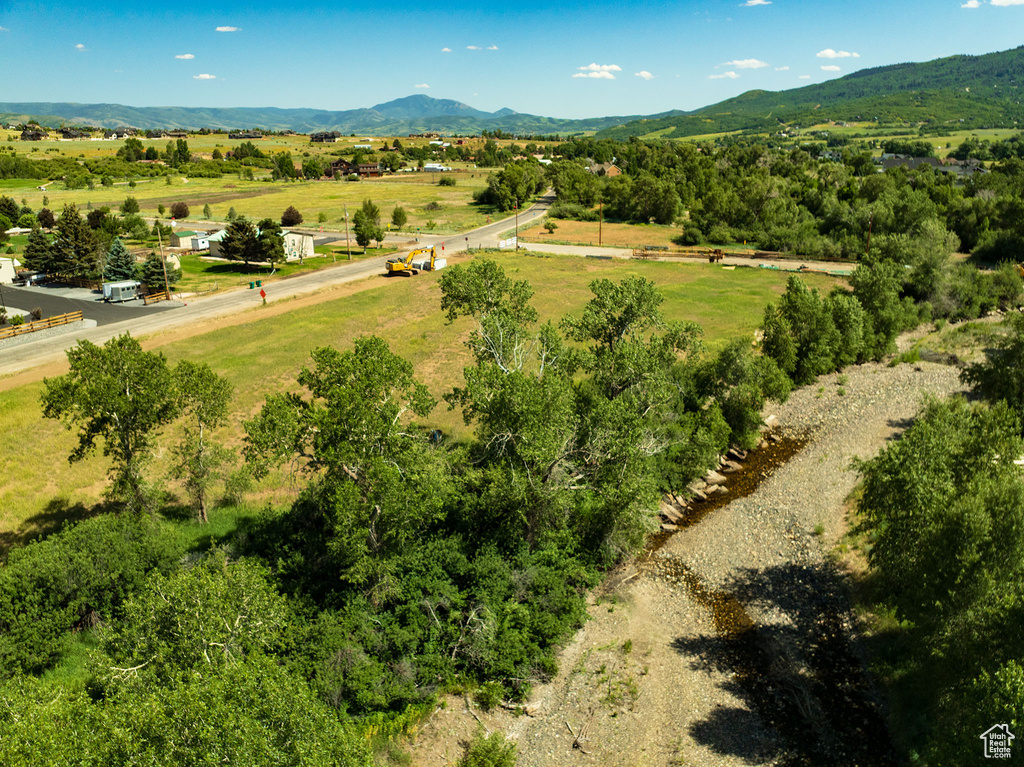 Aerial view of sparsely populated area featuring a mountain backdrop