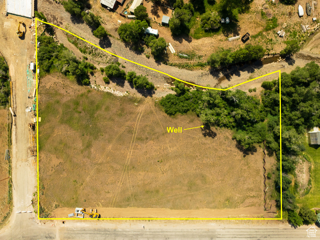 Aerial view of property and surrounding area featuring property boundaries highlighted