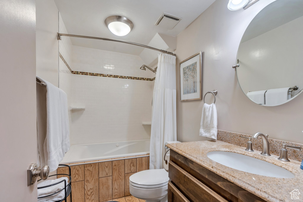 Full bath with shower / bathtub combination with curtain and vanity