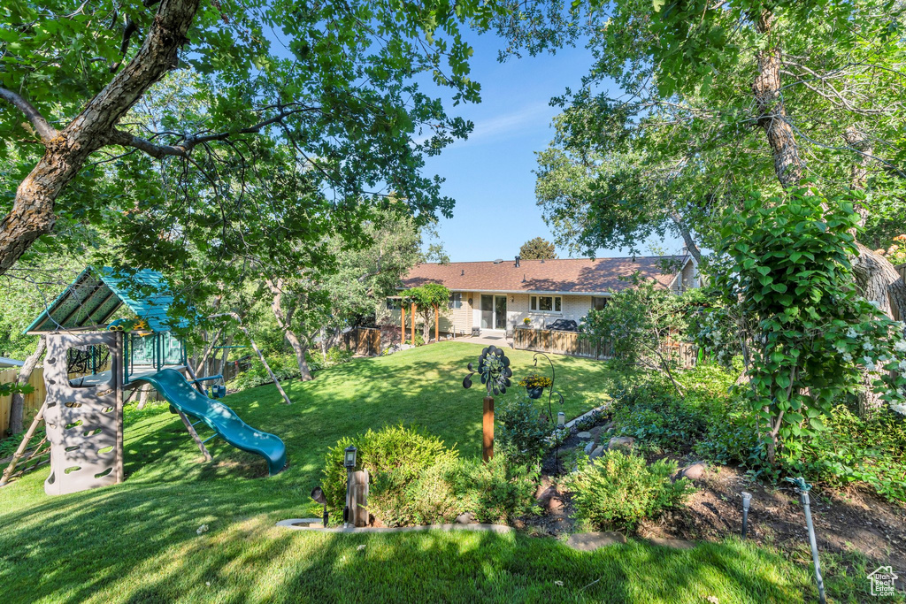 View of yard featuring a playground