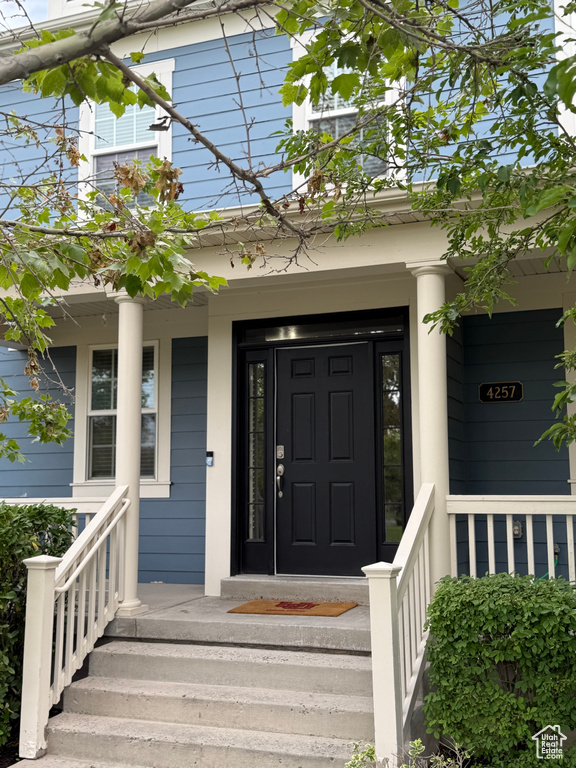 Property entrance with a porch