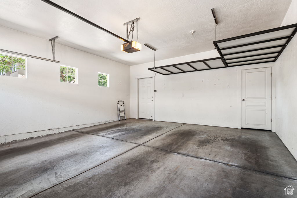 Garage featuring a garage door opener