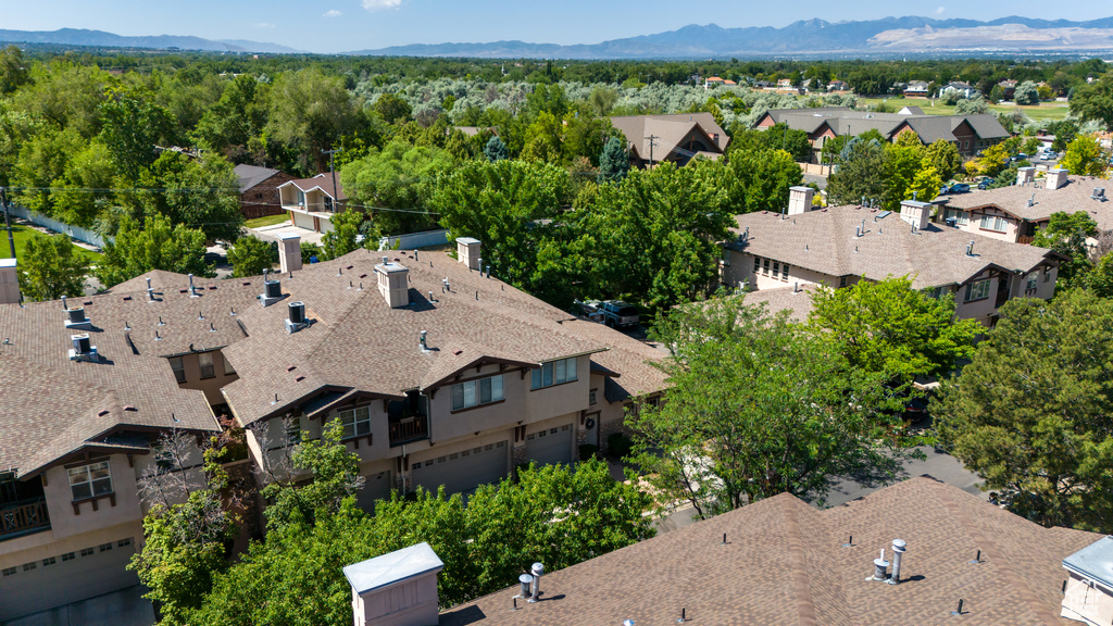 Aerial perspective of suburban area with a mountain backdrop