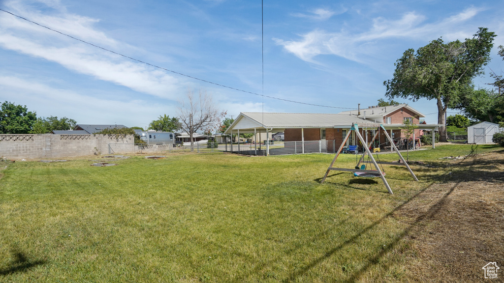 View of yard with a playground