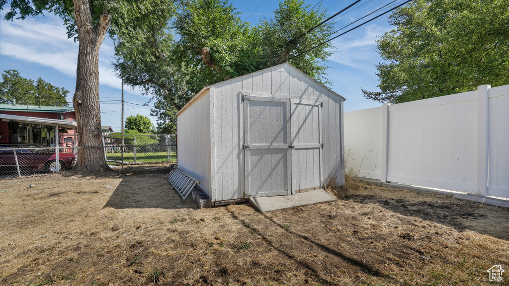 View of shed featuring a fenced backyard