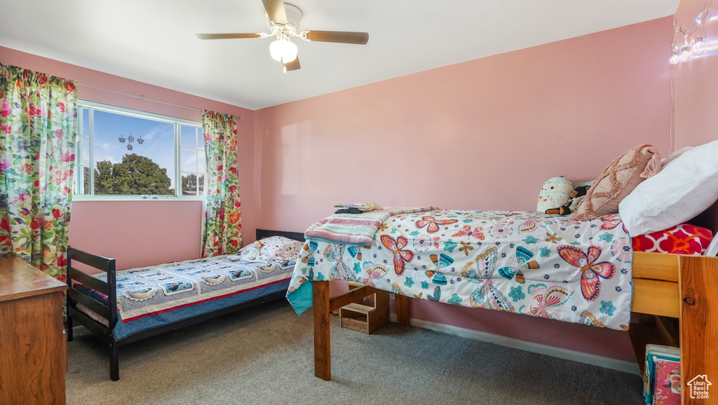 Bedroom featuring carpet and a ceiling fan
