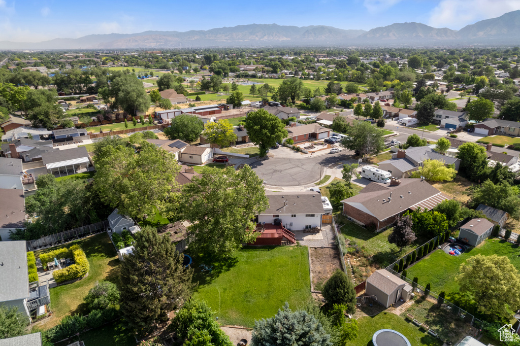 Aerial perspective of suburban area with a mountain backdrop