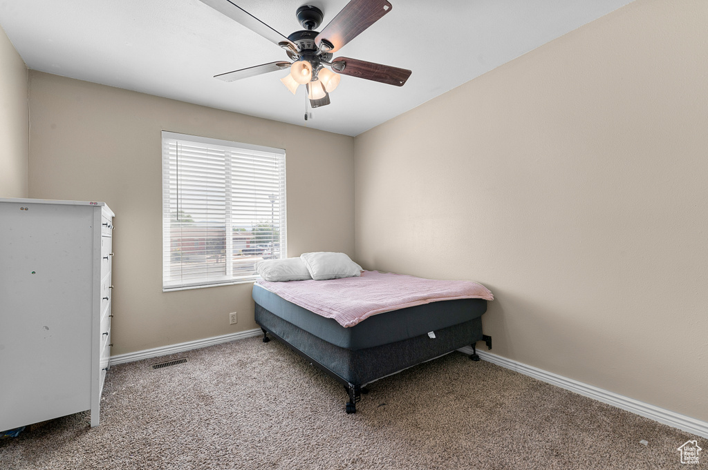 Bedroom featuring carpet flooring and ceiling fan