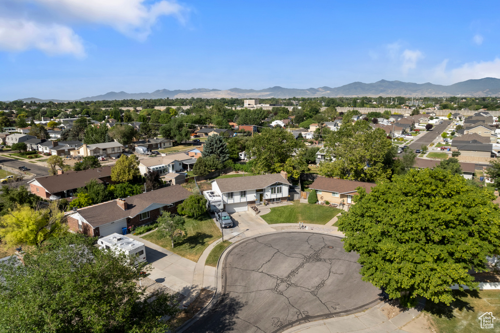 Aerial view of residential area featuring a mountain backdrop
